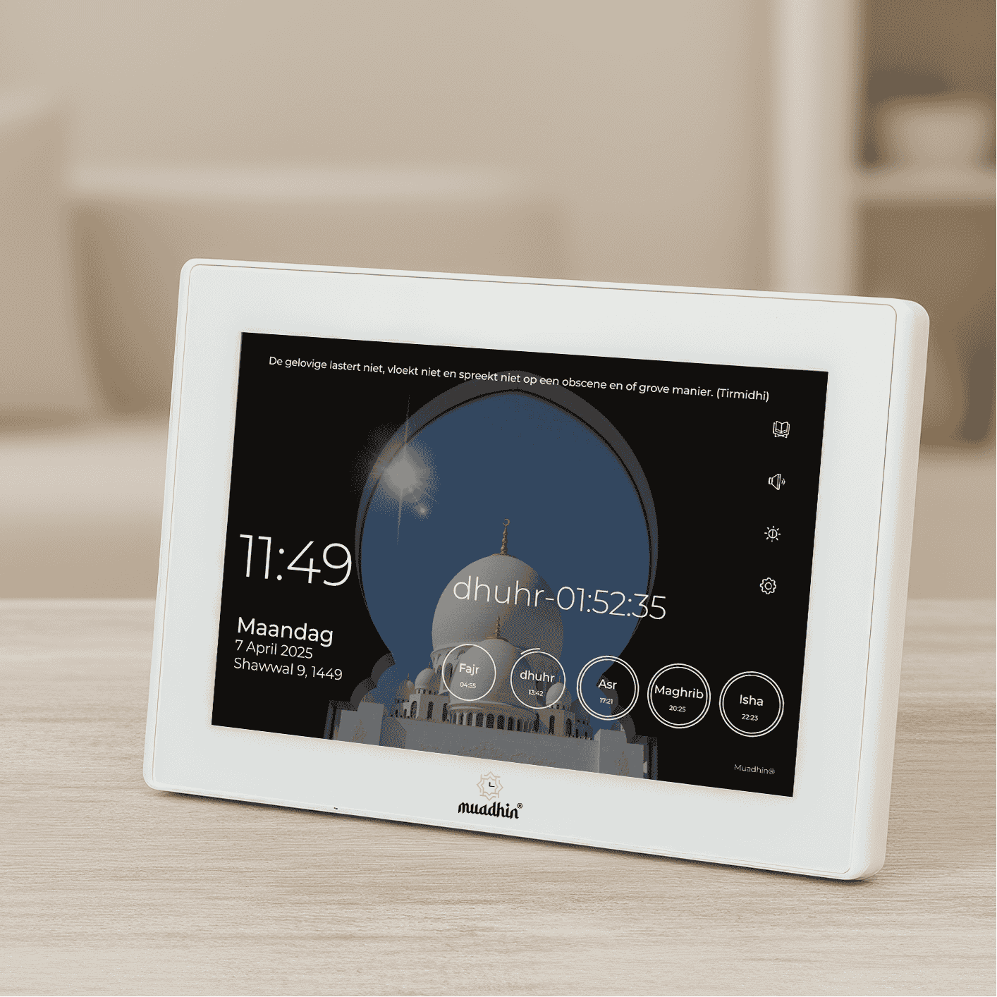 Digital device displaying time and prayer information on a table

